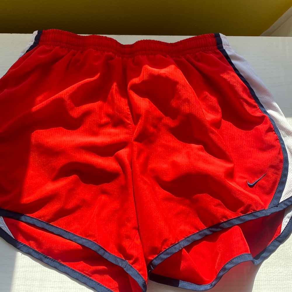 Red Nike shorts